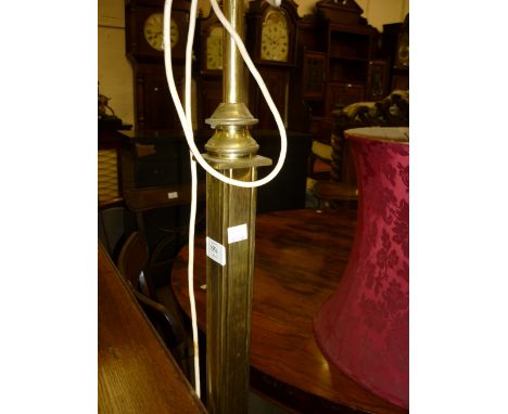 Edwardian brass lamp standard of square form on a square base with paw supports