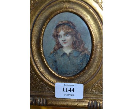 Gilt framed miniature portrait of a young lady with red hair
