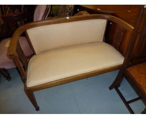 Edwardian mahogany line inlaid bow back two seat sofa raised on square tapering spade supports