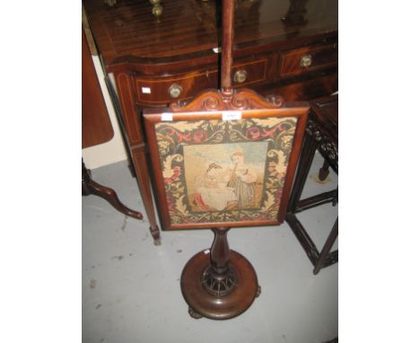 19th Century walnut pole screen with tapestry and needlework adjustable panel on circular base with low feet