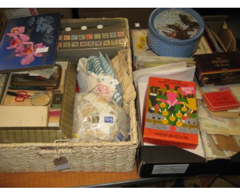 Two boxes containing a large quantity of various loose World stamps, First Day covers, magnifying glasses and various other s