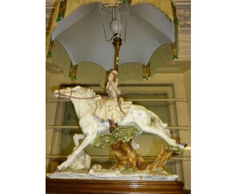 A. Belcari, for Capo di Monte, a porcelain model of a female rider and horse adapted for use as a table lamp