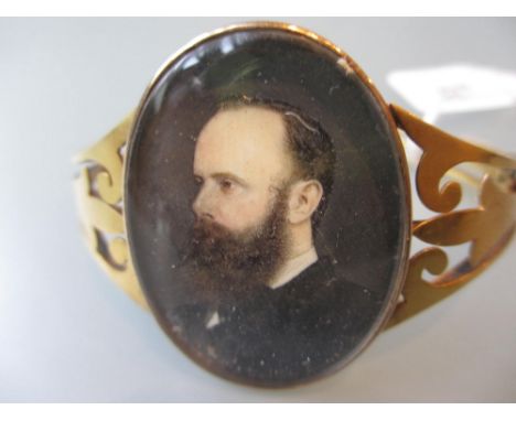 Victorian 15ct gold bangle inset with a painted miniature portrait of a gentleman