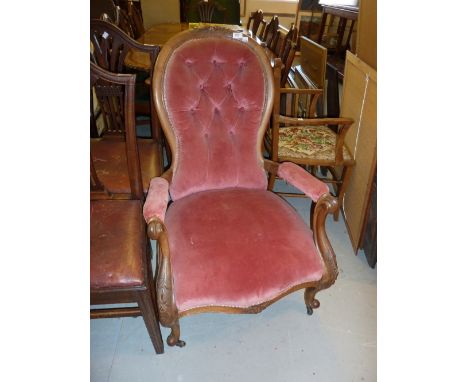 Victorian carved walnut and button upholstered open arm drawing room chair on cabriole supports