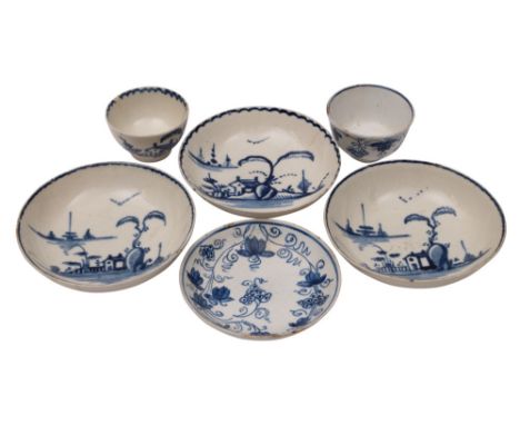 A Bow blue and white 'toy' teabowl and saucer, a similar Liverpool teabowl and three saucers the Bow painted in the vine patt