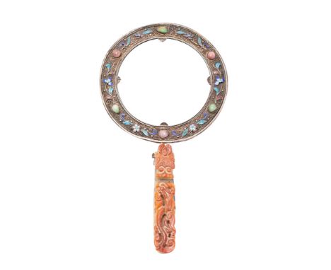 A Chinese magnifying glass in enamel and hardstone decorated white metal frame with associated carved jade dragon belt hook h