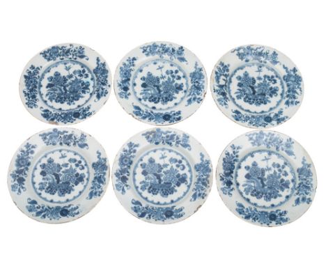 A set of six Irish blue and white delftware plates painted in the 'Chinese Flower-bowl' pattern, painter's numeral marks, Dub