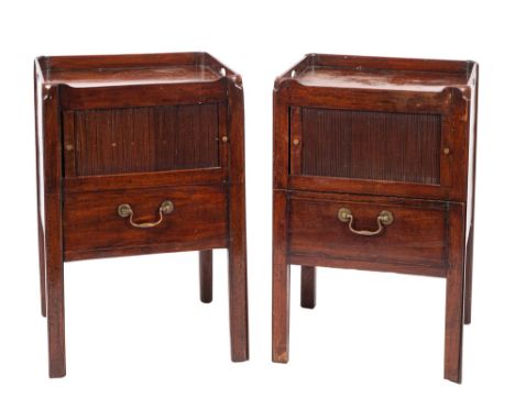 A near matching pair of George III adapted tray top commodes, the tops with pierced carrying handles, each enclosed by a tamb