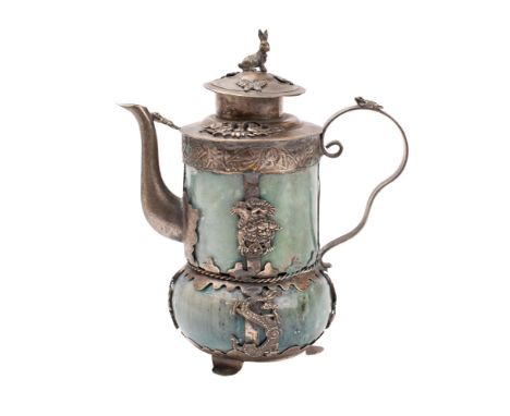 A Chinese white-metal and jade mounted teapot and cover with rabbit finial, the body applied with birds, butterflies and myth