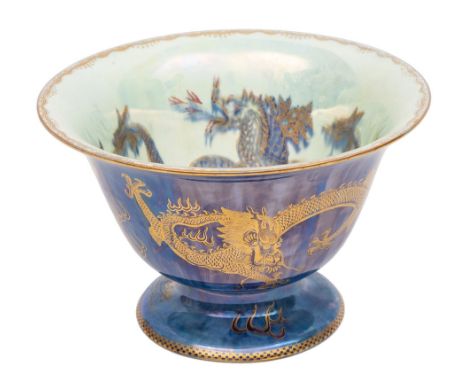 A Wedgwood ordinary lustre bowl, of pedestal form the interior and exterior decorated with gilt dragons on either a blue or p