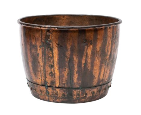 A Victorian copper basin, now utilised as a log bin, mid 19th century; with riveted seams; 38cm high, 51cm diameter