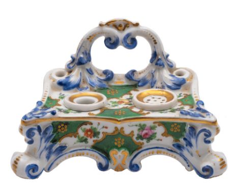 A French porcelain ink stand with inkwell and sander, moulded with acanthus and decorated with flowers and green ground panel