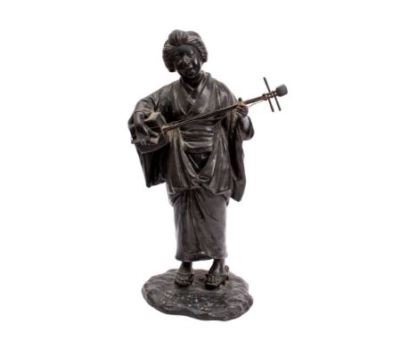 A Japanese bronze figure of a bijin musician, signed Jonan wearing a kimono and playing a shamisen with a large plectrum, on 