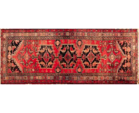 A Heriz Runner,  the rose pointed field with triple chocolate brown stepped medallions, chocolate brown spandrels and main li