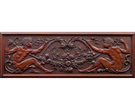 A carved mahogany figural relief panel in Arts and Crafts style, circa 1900; with two seated and nude youths restraining styl