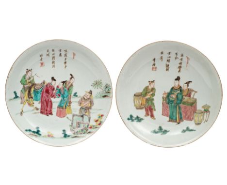 A pair of Chinese famille rose saucer dishes signed "Zhuju" with seal and artemisia leaf , painted with court figures in a ga