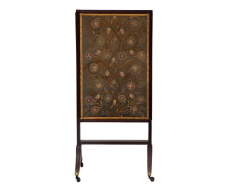 A Regency mahogany and embroidered rectangular firescreen, early 19th century; the later inset Arts and Crafts style foliate 
