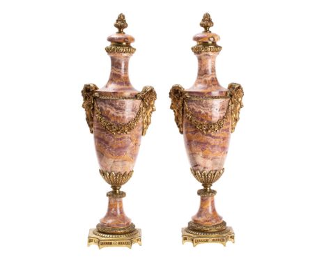 A pair of Continental alabastro fiorito and gilt metal mounted twin handled urns, early 20th century; each with foliate cast 