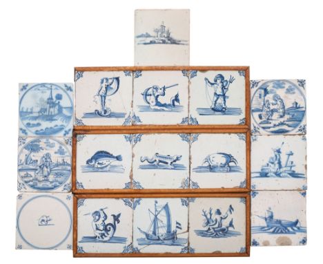 A collection of English and Dutch blue and white delftware tiles in three frames and loose, painted with animal, figural, mar