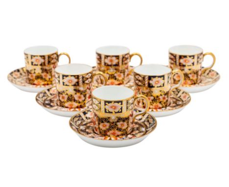 Six Royal Crown Derby coffee cans and saucers in the Imari pattern, red backstamps and date codes for 1928, one can 1926.