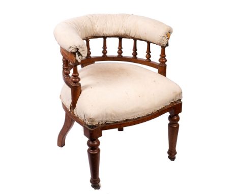 An early Victorian oak and partially upholstered library tub chair, circa 1840; the padded backrest on knop turned spindle su
