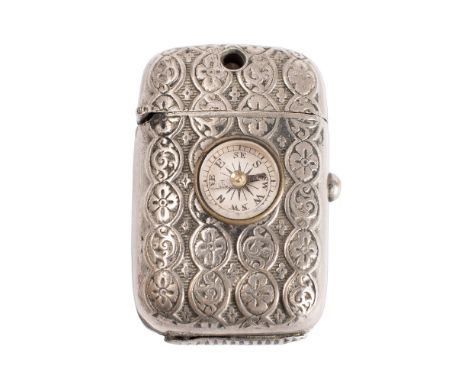A novelty Stanhope vesta case, late 19th/early 20th century, in plated metal with inset compass and peep revealing various vi