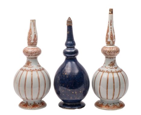 A pair of Chinese rouge-de-fer rose water sprinklers and a powder blue sprinkler all of baluster form with knopped slender ne
