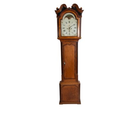 A late-Georgian oak and mahogany moonphase longcase clock having an eight-day duration movement striking the hours on a bell 