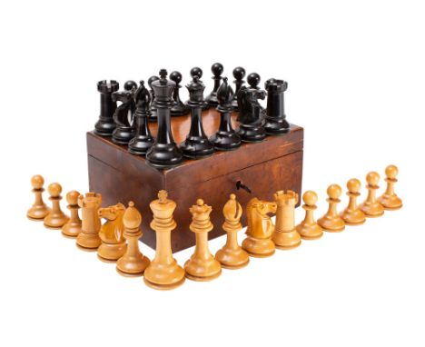 Jaques, London; a boxwood and ebony Staunton pattern weighted chess set, early 20th century; one rook and one knight from eac