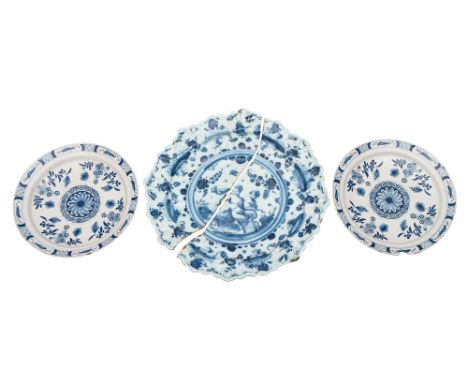 A large Savona blue and white maiolica moulded dish and a pair of Dutch blue and white delftware dishes the first painted wit