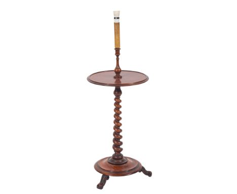 A Victorian mahogany circular lamp table, adapted for electric light, having a turned baluster and spirally turned column and