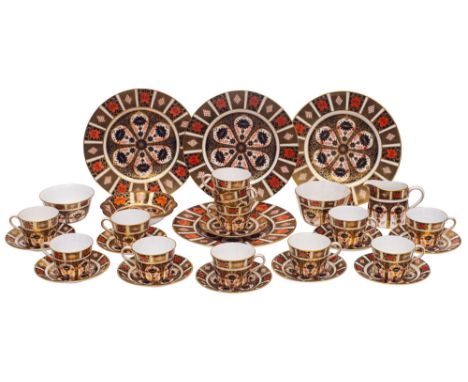A Royal Crown Derby Old Imari  tea service, comprising;-  twelve cups, ten saucers, two sugar bowls, milk jug, shallow dish a