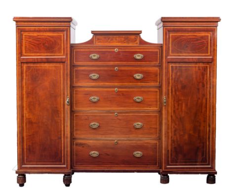 A Victorian mahogany and cross banded chest wardrobe, late 19th century; the central section of five graduated drawers, all w