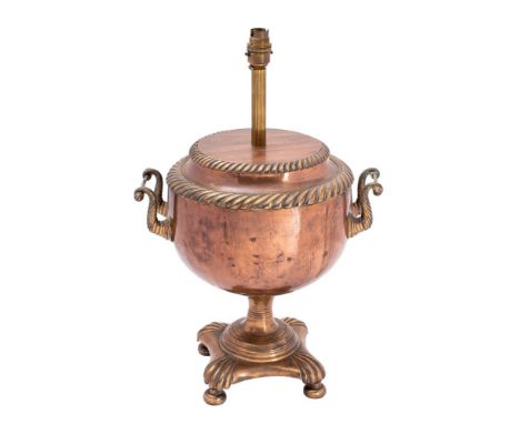 A 19th century copper Samovar converted to a lamp with gadrooned borders, scroll handles to the sides, raised on a square bas