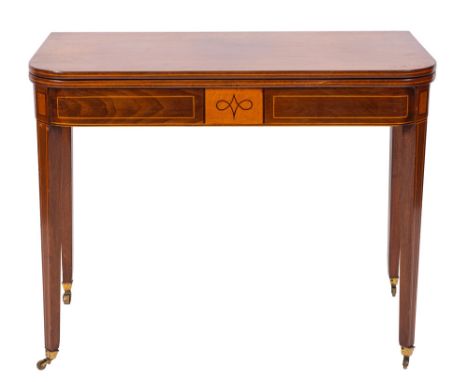 An early 19th Century mahogany and inlaid rectangular tea table, bordered with sycamore and ebonised lines, the hinged top wi