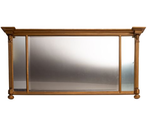 A gold painted wood and composition overmantel mirror in Regency style, early 20th century; of inverted breakfront form, the 