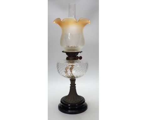 A Victorian brass stemmed oil lamp and glass shade, 50cms including shade