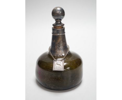 An 18th century green glass onion-shape bottle, with later silver mount, London, 1899, together with a George III silver 'S' 