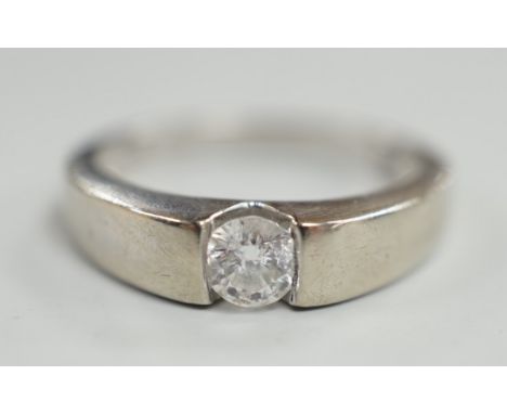 A modern 9ct white gold and solitaire diamond set ring, the stone weighing 0.34ct, size M/N, gross weight 3.2 grams.