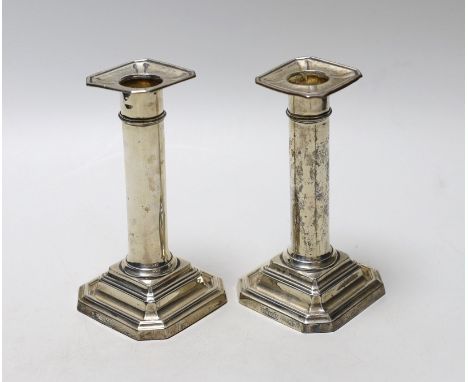 A pair of George V silver mounted dwarf candlesticks, James Dixon &amp; Sons, Sheffield, 1913, 13.8cm, weighted.