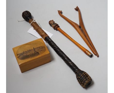 A pair of novelty treen glove-stretchers, 19cm, a similar pipe, a mauchline box and a 19th century beater