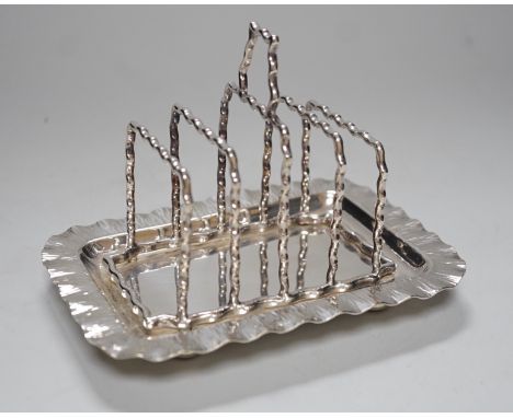 A Hukin &amp; Heath silver plated toast rack, 16cm long