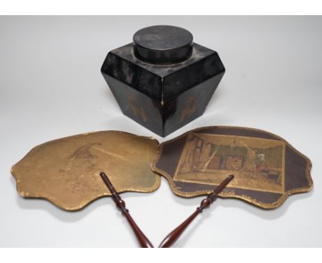 A pair of 19th century face fans, 36cm high, and a black lacquer tea caddy