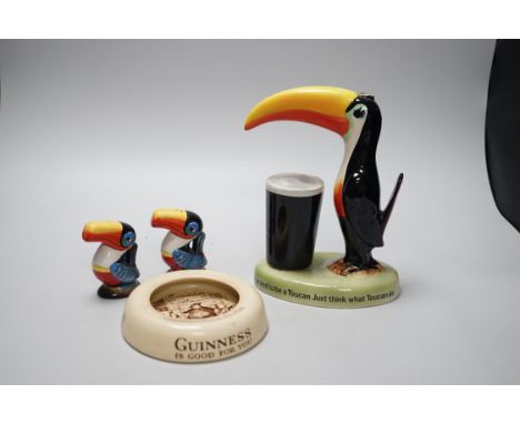 A Guinness toucan lamp-stem, 26cm high, and three related items