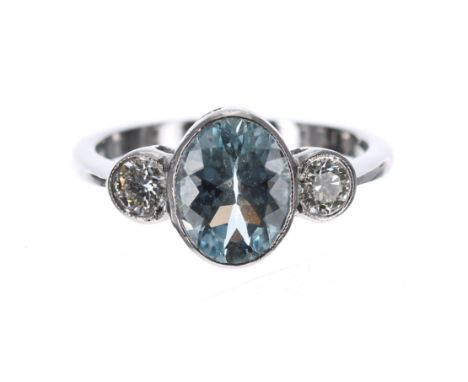 Aquamarine and platinum three stone ring, the oval aquamarine 1.70ct approx, round brilliant-cuts, 0.42ct in total, clarity S