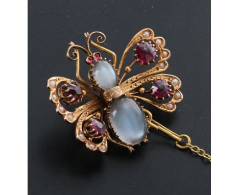 Attractive yellow metal moonstone, garnet and pearl butterfly brooch with sprung wings and clip back on a safety chain, 4.8gm
