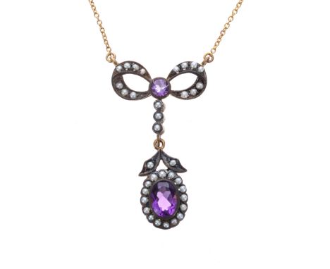 Ornate amethyst and pearl bow pendant on a slender 9ct yellow gold necklace, 4.6gm, the pendant drop 38mm; with box 