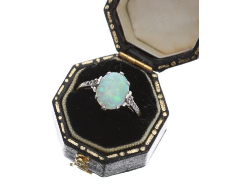 Attractive 18ct and platinum opal and diamond set ring, the opal 1.10ct approx, claw set with three small round diamonds to e