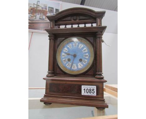 An Edwardian mantel clock with enamel dial, in working order