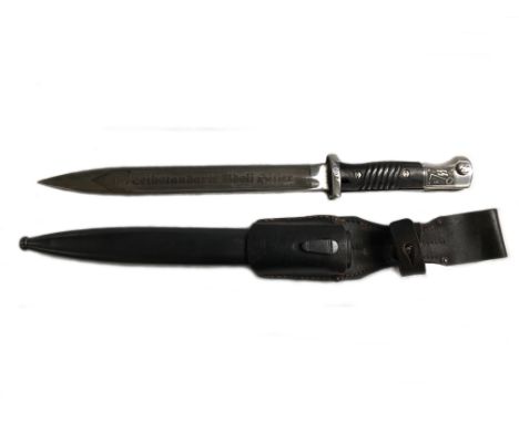 A military dagger with Nazi Germany SS Panzer emblem and scabbard